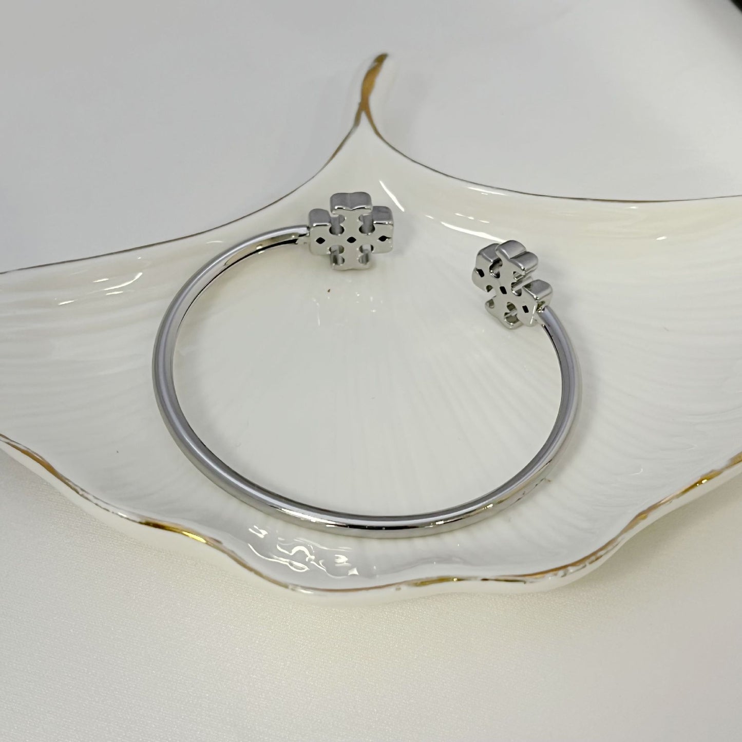 Open Tory Burch double logo metal bangle, silver tone, hinged clasp detail