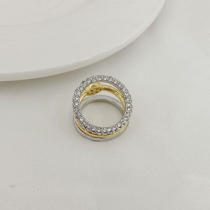 Rhinestone outer band three-band ring with gold center and open silver frame