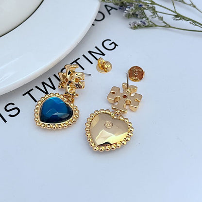 Gold-plated Heart Drop Earrings shown front and back with blue shell heart stone