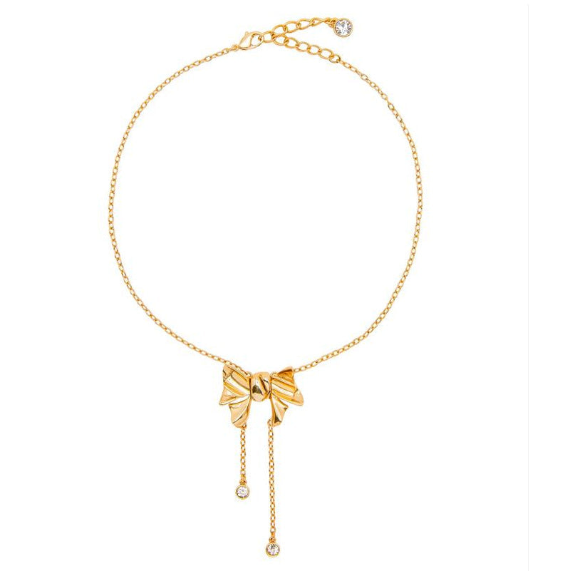 Gold-tone bow crystal tassel necklace with three dangling round stones