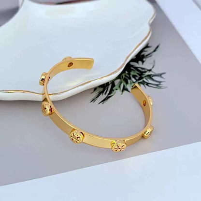 Tory Burch Embossed Metal Open Bangle Gold Color