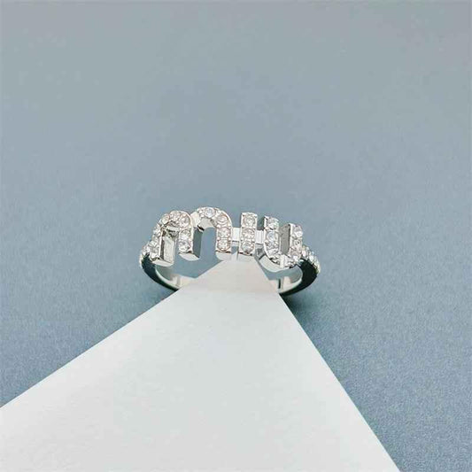 Silver-toned open ring with a row of sparkling stones, adjustable