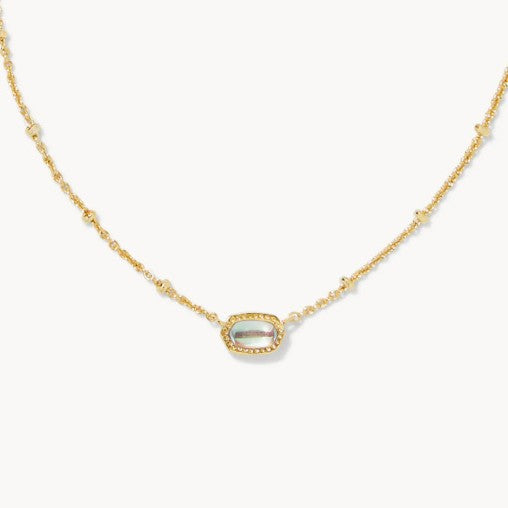 Gold-tone necklace with small oval white gemstone pendant on a fine chain.