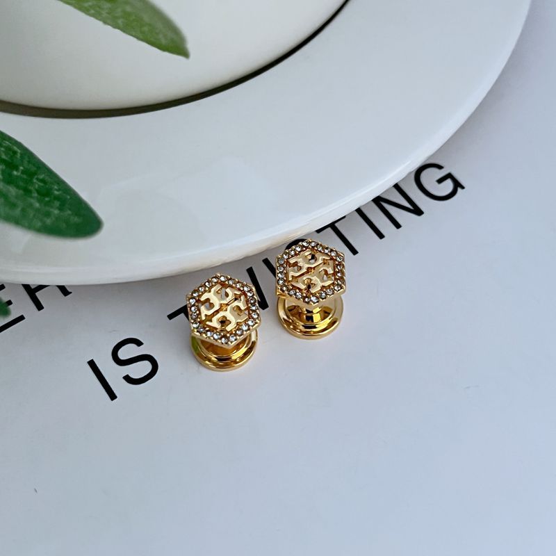 Gold hexagonal openwork metal stud earrings with pavé gems