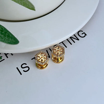 Gold hexagonal openwork metal stud earrings with pavé gems