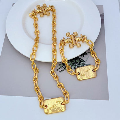Tory Burch rectangular metal plaque thick chain necklace bracelet