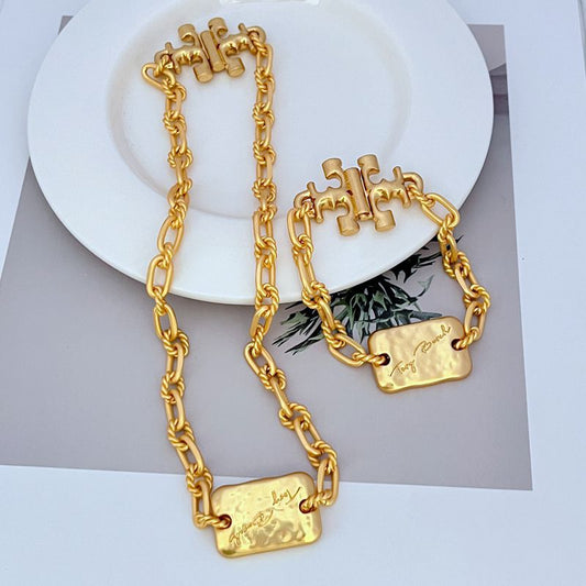 Tory Burch rectangular metal plaque thick chain necklace bracelet