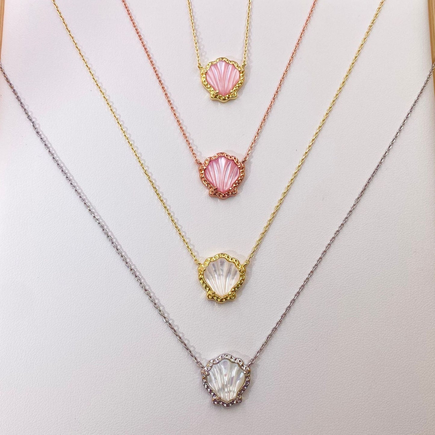 Multi-color pendant necklace set with scallop bezels and mother-of-pearl shell drops