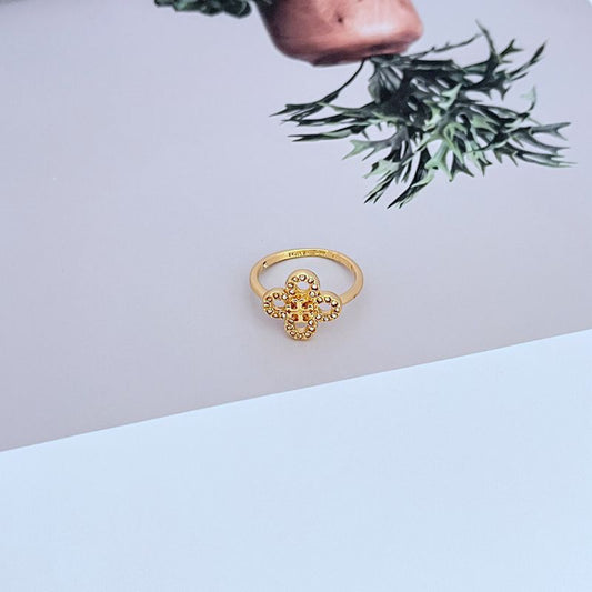 Gold four-leaf clover diamond ring, four petals with central round stone