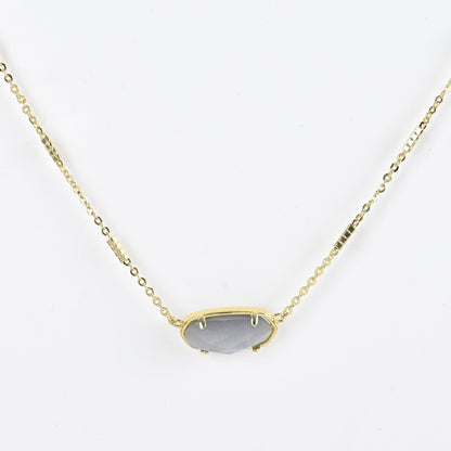 Oval crystal necklace with gold-tone chain and gray oval stone