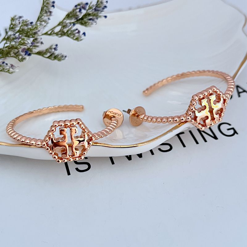 Tory Burch C-shaped hollow metal earrings for women