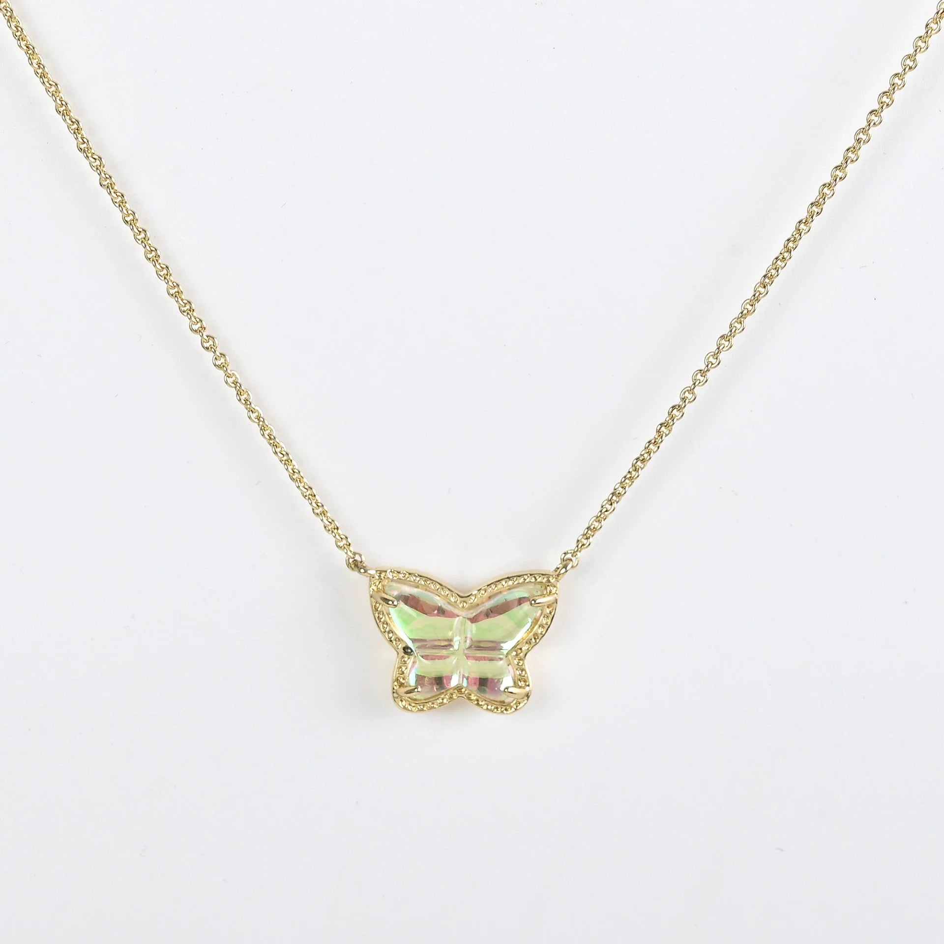 Gold butterfly pendant necklace with iridescent multi-color stone
