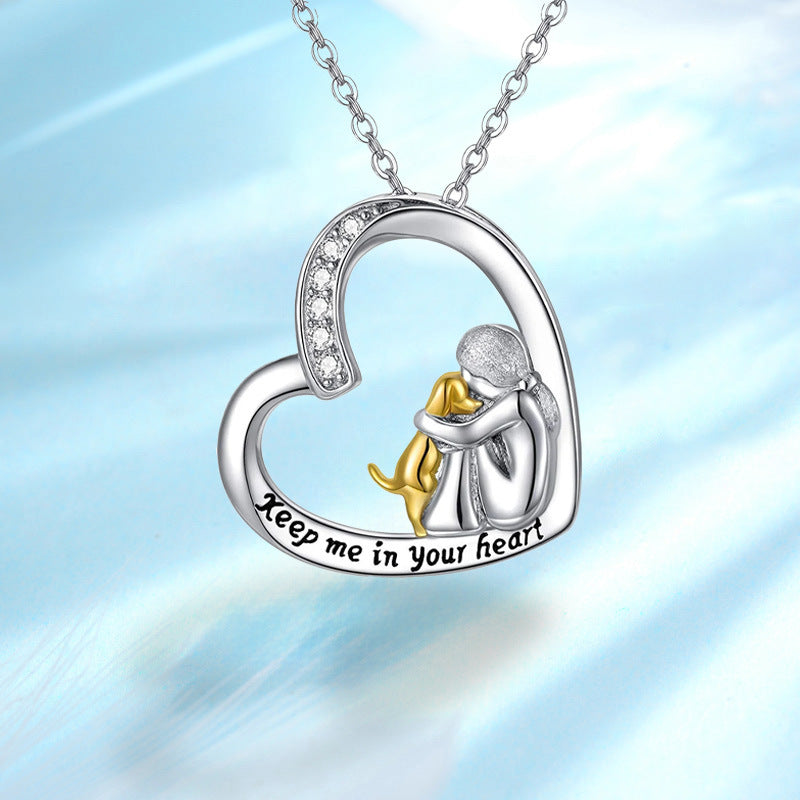 Heart pendant necklace featuring a mother-and-child figure, “Keep me in your heart”