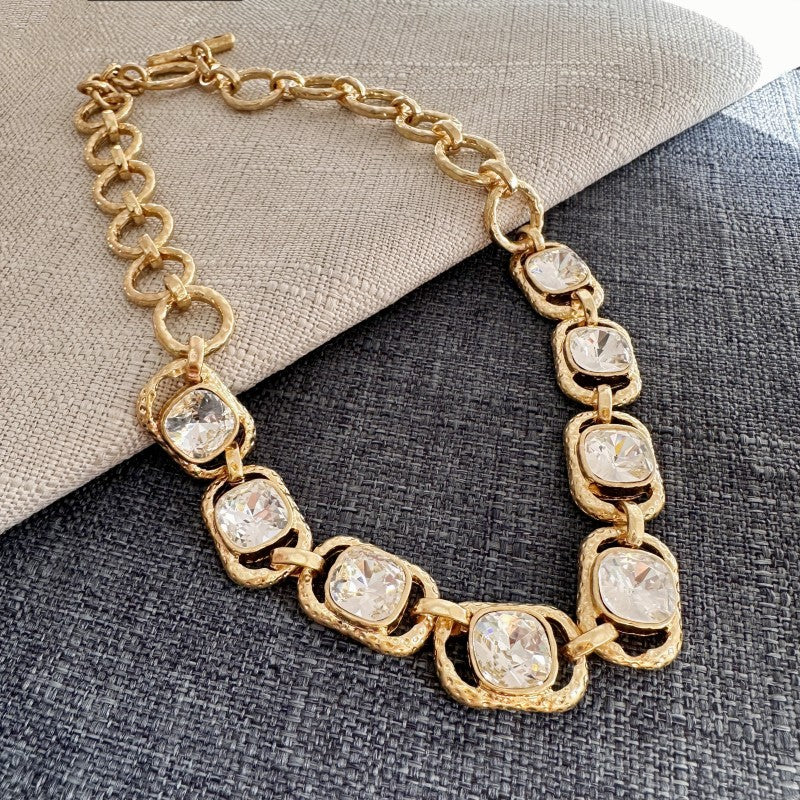 Gold-tone chain necklace with oval clear faceted crystals
