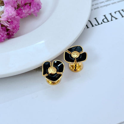 Tory Burch enamel camellia stud earrings with black petals and gold-tone frames
