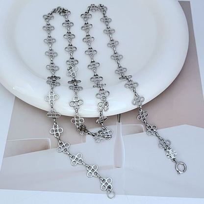 Four-leaf clover sweater chain necklace with silver-tone linked pendant drops