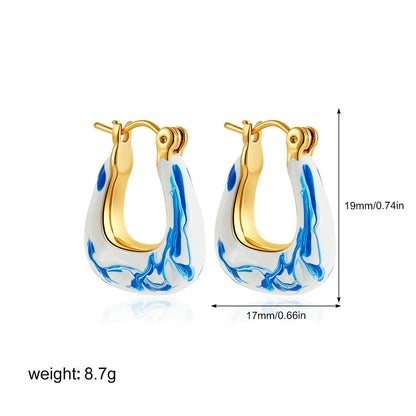 Dakota Marble Blue statement hoop earrings, gold-tone with blue swirl inlay