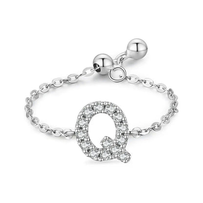Sterling silver pavé letter Q bracelet with link chain and round toggle clasp