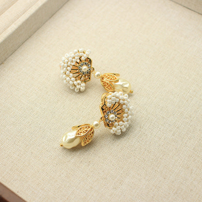 Fan-shaped pearl and gold-plated drop earrings with dangling teardrop pearl accents