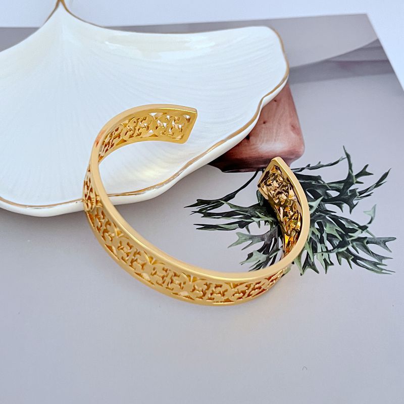 Tory Burch Fashionable Openwork Logo Metal Bangle