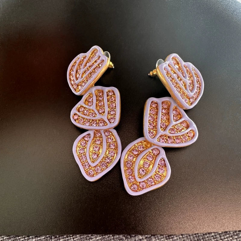 Gold-plated leaf pendant earrings with pale purple enamel hearts and pink crystal rows