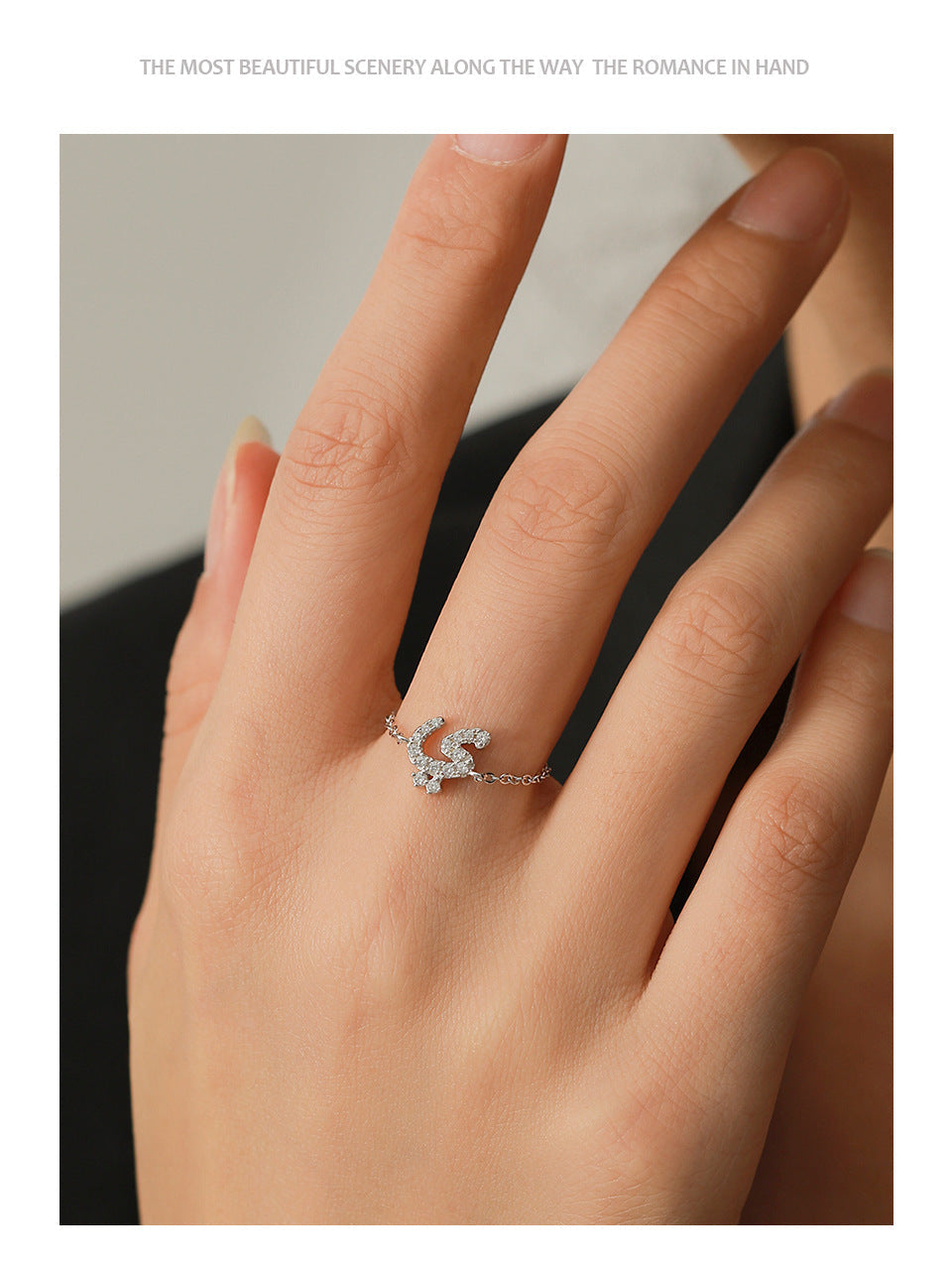 Silver-tone adjustable chain ring with pavé Arabic letter charm on finger