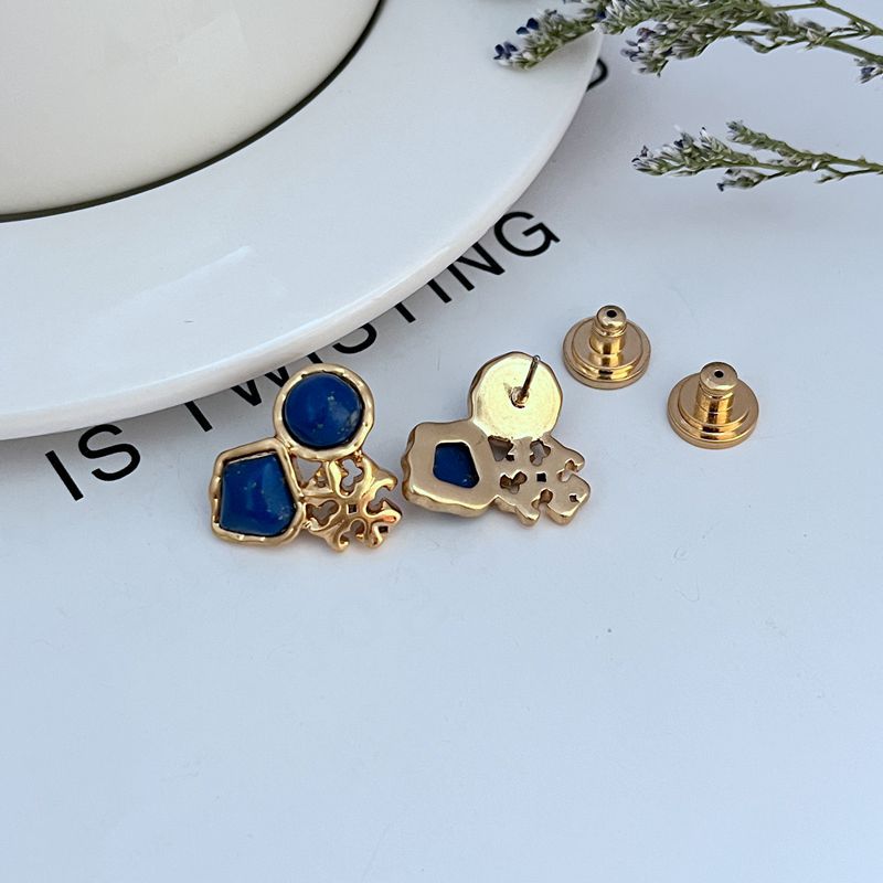 Gold-tone stud earrings with backs and posts, blue geometric front stones