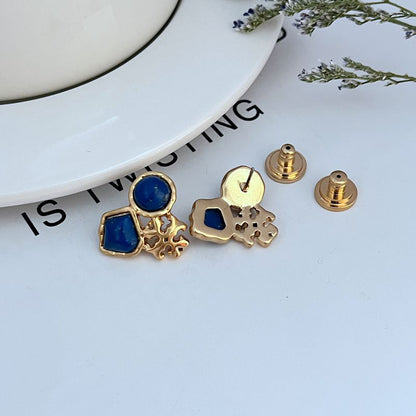 Gold-tone stud earrings with backs and posts, blue geometric front stones