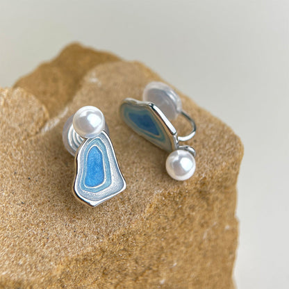 Blue enamel drop earrings with white pearls and hinged clip style backs