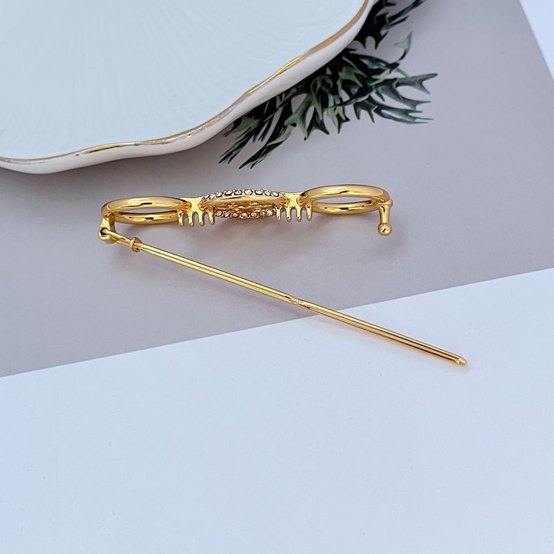 Tory Burch Diamond-Studded Round Metal Hair Clip