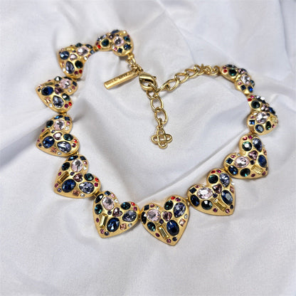 Vintage heart-shaped crystal necklace with gold chain and multi-colored rhinestone hearts
