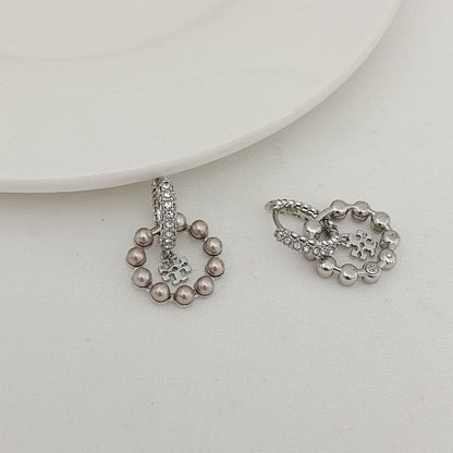 Silver-tone pearl and rhinestone earrings with cross charm and chain details