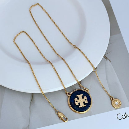Gold-tone circle coin pendant necklace with purple and light coin charms on chain