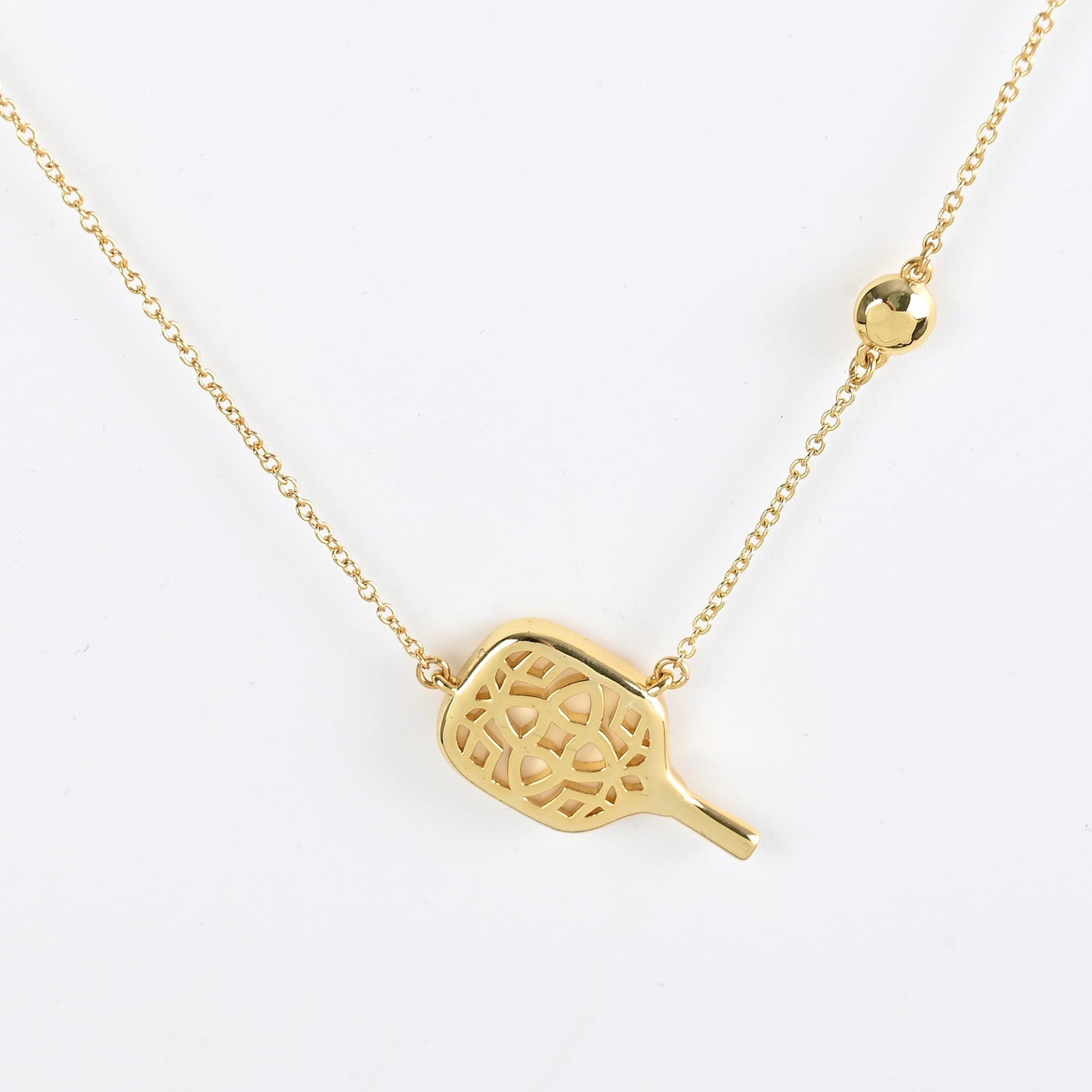 Gold tennis racket pendant necklace with cutout racket charm pendant