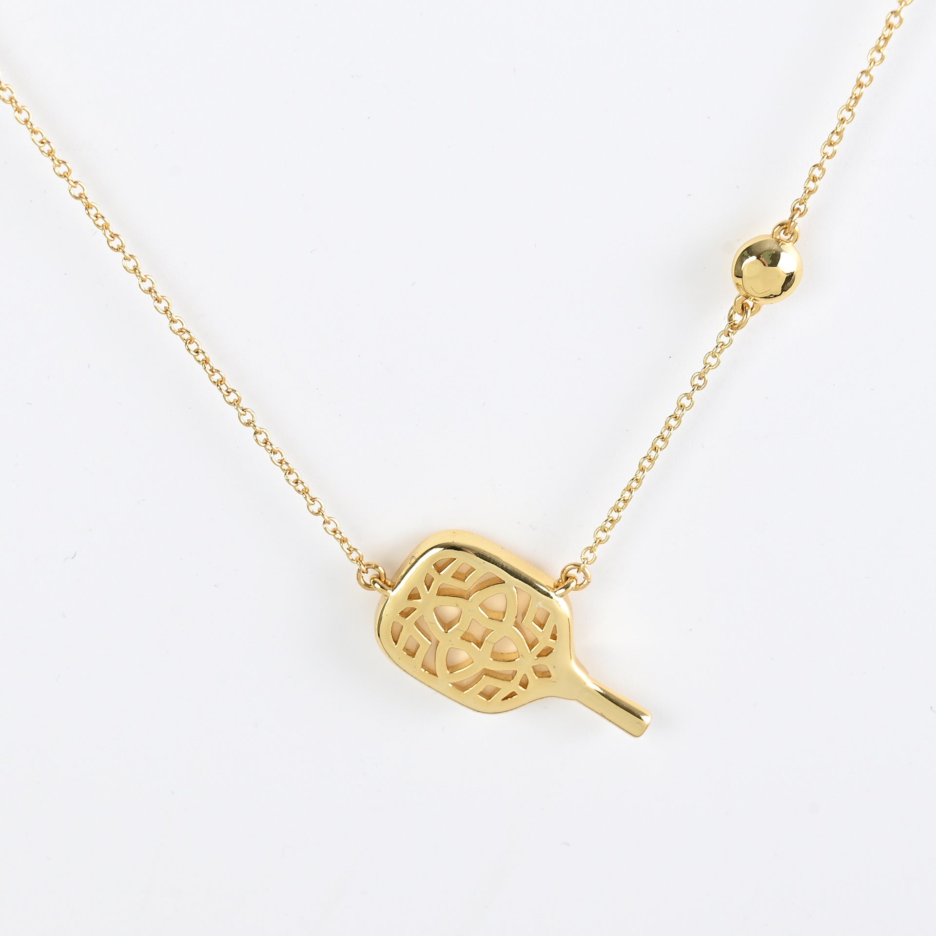 Gold tennis racket pendant necklace with cutout racket charm pendant