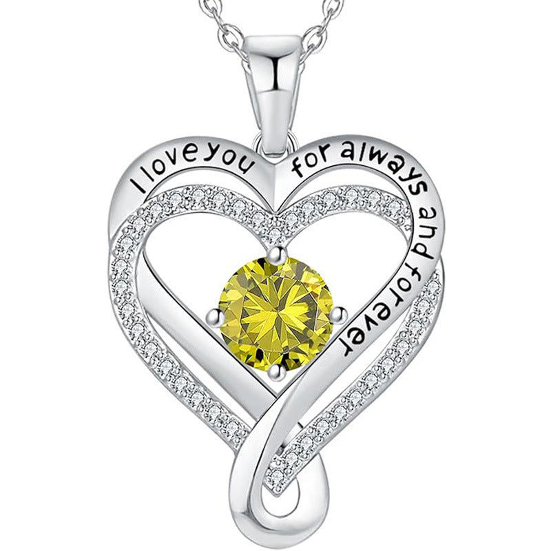 Silver heart pendant necklace with yellow round gemstone and rhinestone heart outline