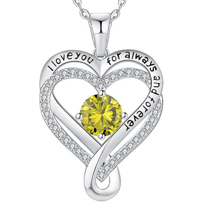 Silver heart pendant necklace with yellow round gemstone and rhinestone heart outline