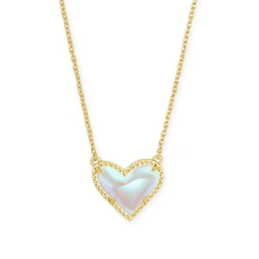 Heart pendant necklace with iridescent white heart and gold-tone chain