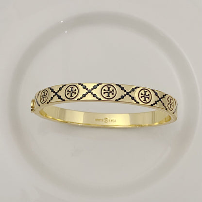 Tory Burch open metal cuff bangle, gold-tone with black enamel lattice logos