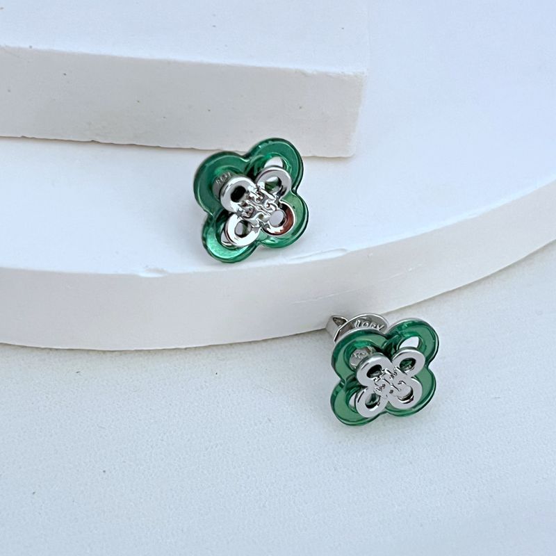 Green openwork clover flower stud earrings with silver-tone filigree and post backs