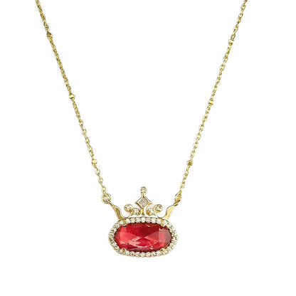 Gold-plated princess crown necklace with red oval gemstone and diamond-style halo