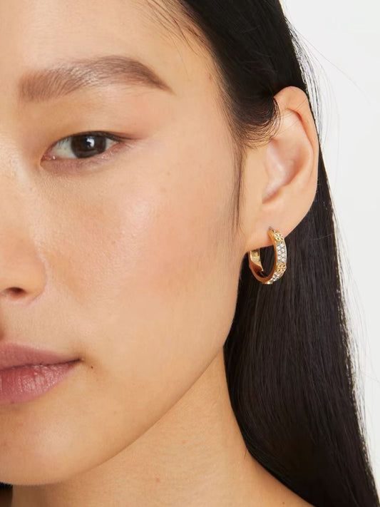 Gold hoop earrings with logo medallion, leopard enamel, and crystal rows