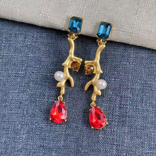 Gold-tone coral branch clip-on earrings with blue square stones, red teardrops, white pearls