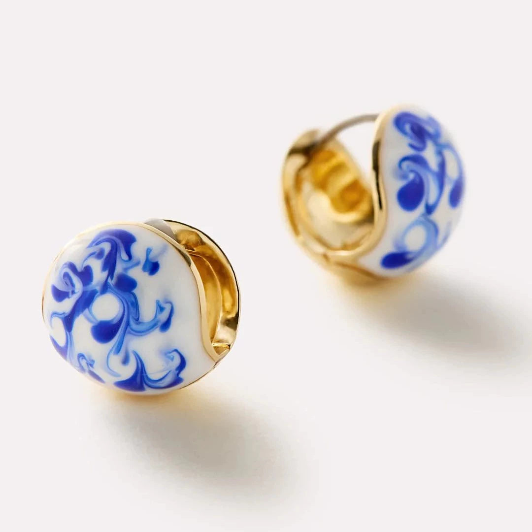 Blue marble stud earrings with gold-tone hoops and hinged backs