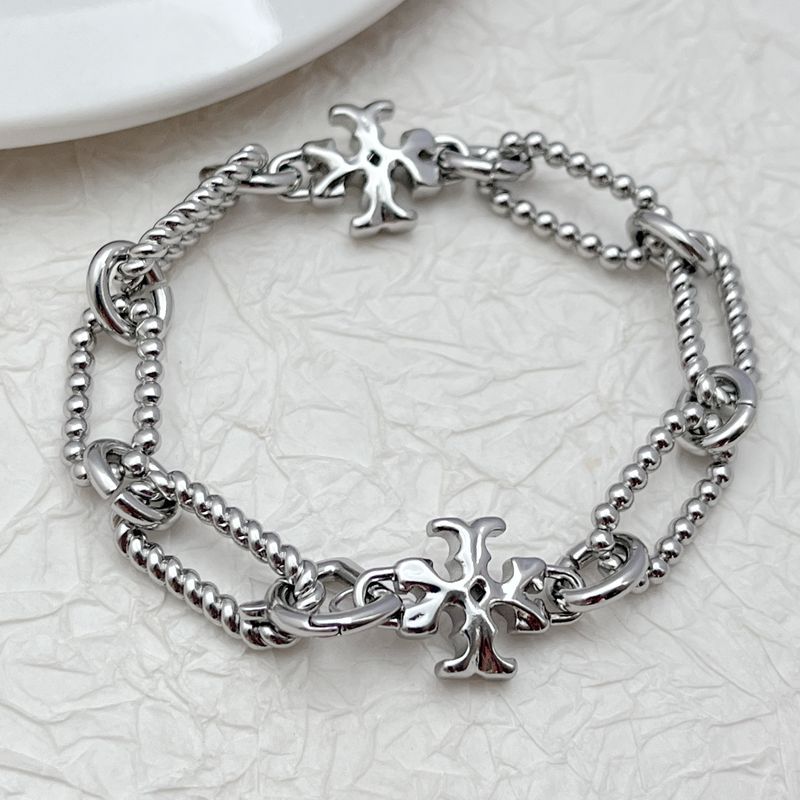 Silver square chunky chain logo bracelet with cross-like emblem charm and twisted chain links