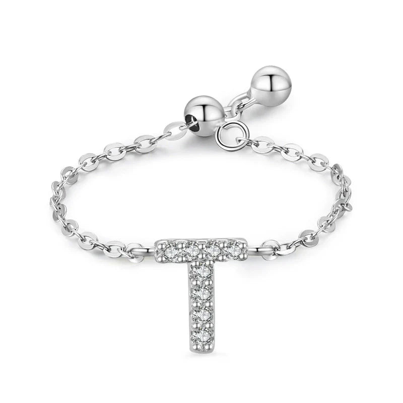 Pavé initial letter bracelet with a dangling “T” charm in sterling silver chain