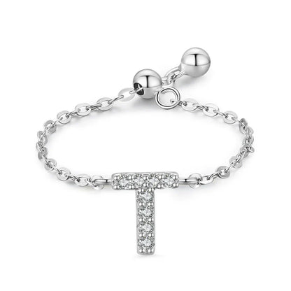 Pavé initial letter bracelet with a dangling “T” charm in sterling silver chain