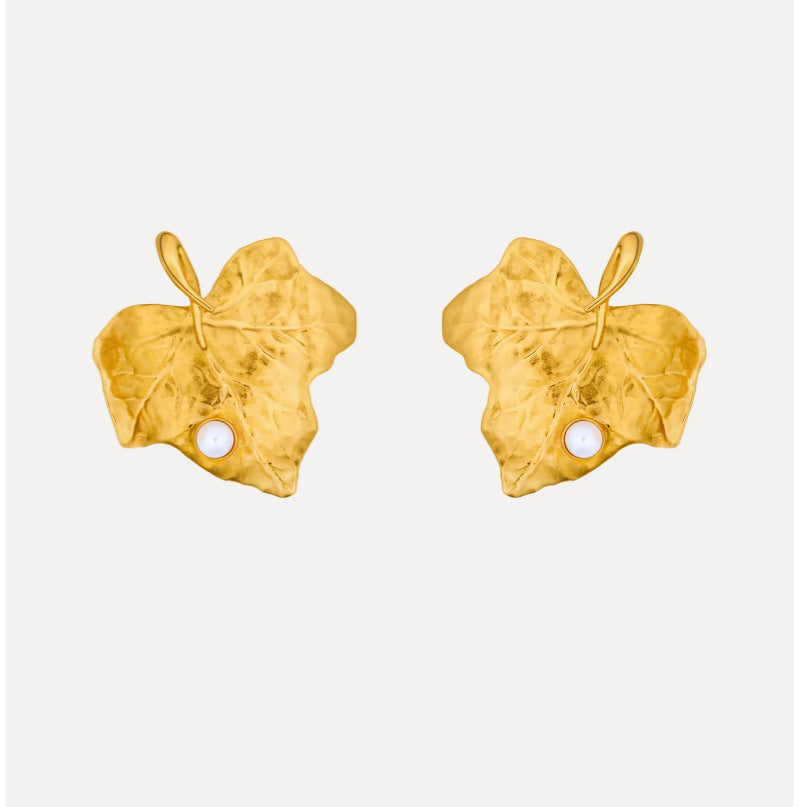Gold-tone botanical ivy leaf earrings with white pearl drop, stud style