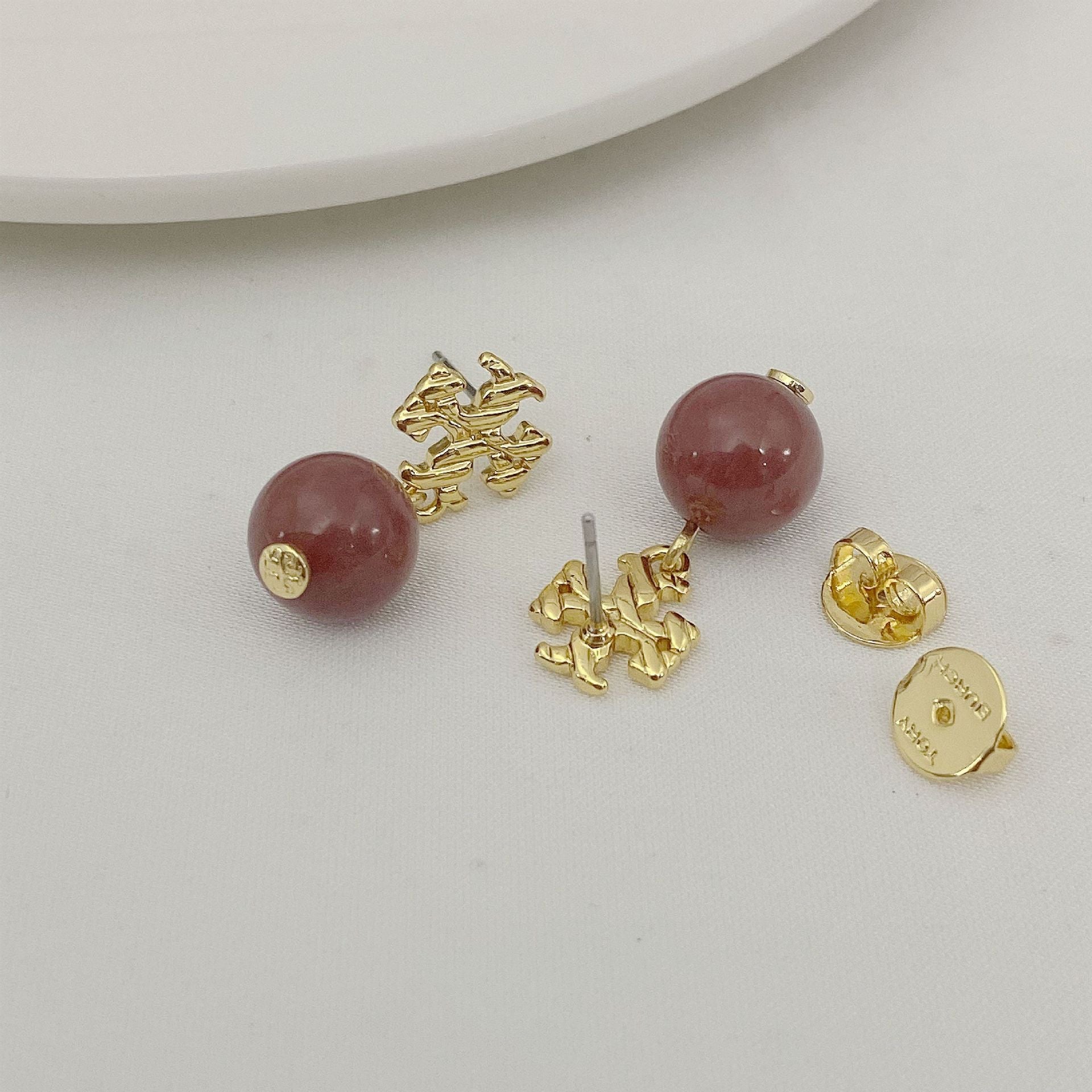 Agate pendant earrings with round rose-red beads and gold-toned textured pendant connectors