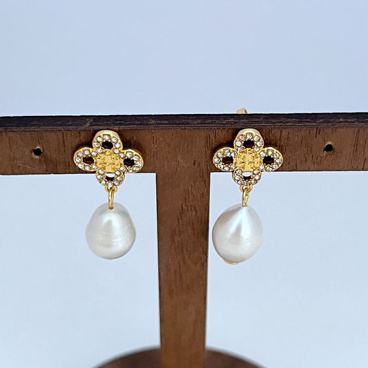 Gold four-leaf clover earrings with diamond accents and white freshwater pearl drops